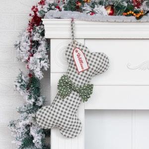 A product display image of a personalized pet stocking with a green plaid pattern