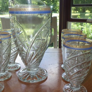 Vintage Pitcher and glass set starburst and X design blue gold band 7 piece set circa 1930