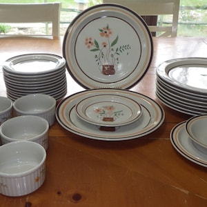 Stoneware Dinnerware Countryside Stoneware 32 piece basket design Excellent used condition