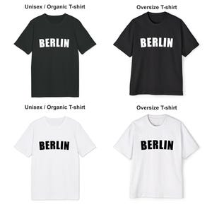 May include: Four t-shirts, two black and two white, with the word "BERLIN" printed in white on the black shirts and in black on the white shirts. The shirts are available in two styles: unisex/organic and oversize.