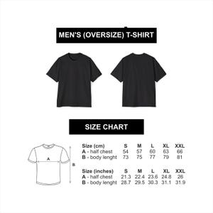 May include: Size chart for an oversized t-shirt in black. The chart shows measurements in both centimeters and inches for sizes S, M, L, XL, and XXL. The measurements include half chest and body length.