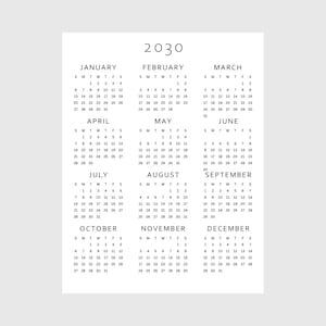 May include: A minimalist 2030 calendar printed on white paper. Each month is displayed with its days of the week, starting with Sunday. The year 2030 is printed at the top in a simple, clean font.