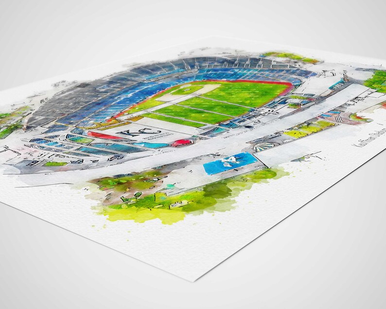 May include: A watercolor illustration of a baseball stadium with a green field, blue seats, and a red and white 'KC' logo. The stadium is surrounded by a green and yellow landscape.