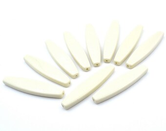 10 platte ovale acryl kralen 64x15mm - ivoor