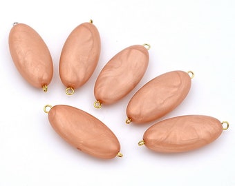 Pack of 10 flat oval pearly acrylic beads 33x15x7mm - beige