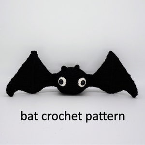 May include: Black crocheted bat with white eyes.  The bat is laying on a white surface with the text "bat crochet pattern" below it.