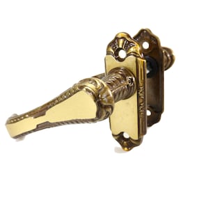One set of exquisitely detailed brass French door-handles and stylish matching finger plates more pairs available