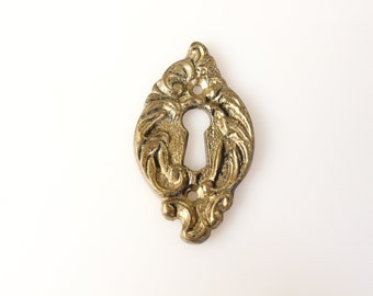 One Antique ornate brass keyhole cover, plate. Ornamental escutcheon, cabinet hardware, furniture applique, Key plate