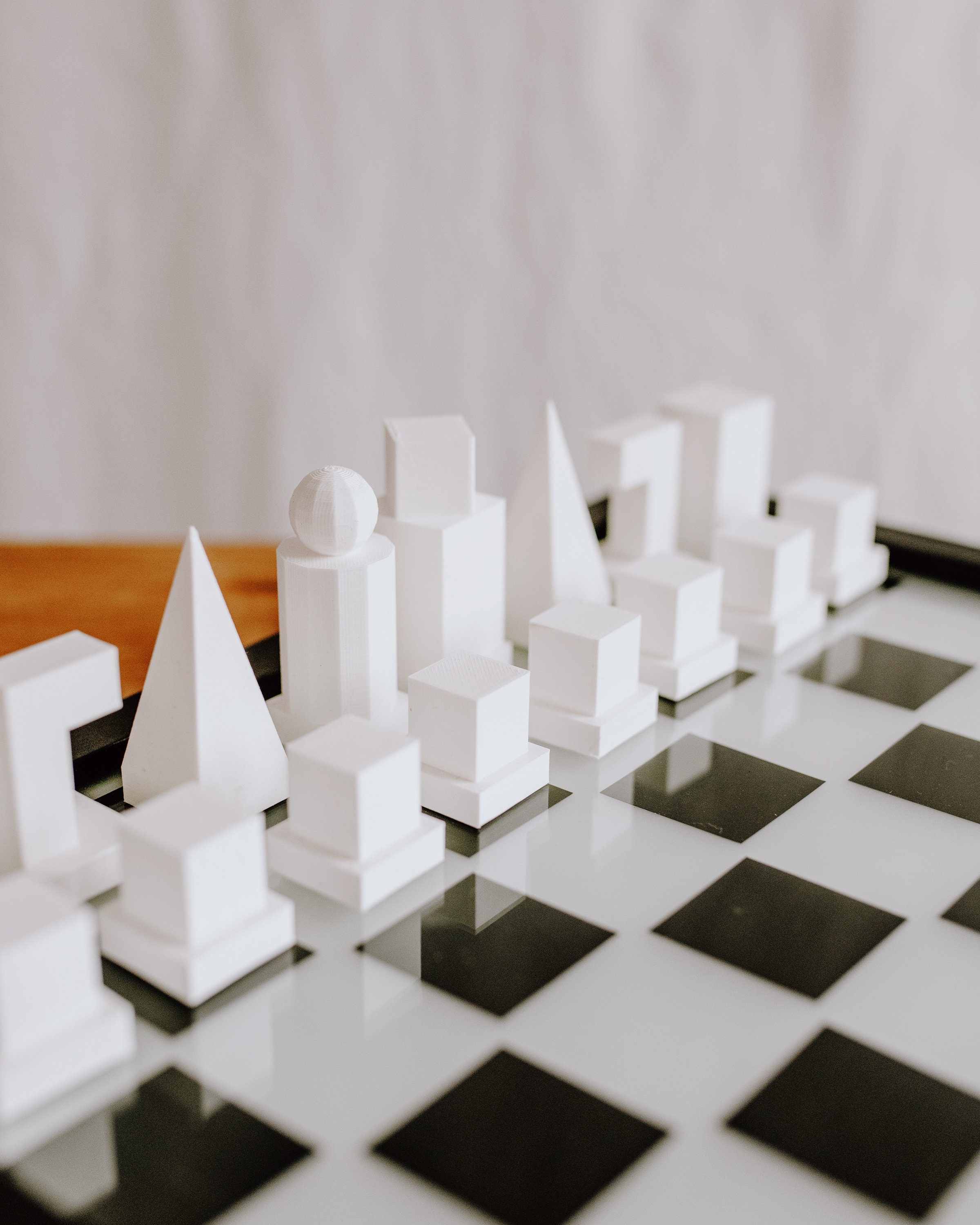 Chessboard with miniature buildings representing  and microsoft