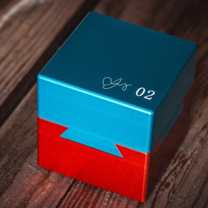 May include: A blue and red box with a white inscription that says "02".