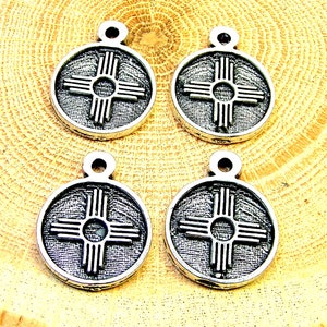 Zia symbol charms lot of 4 pieces