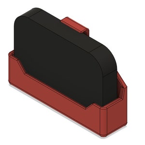 May include: A 3D printed holder for a small electronic device, made of red plastic. The holder has a slot for the device and a lip to keep it in place. The device is not included.
