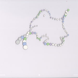 May include: A white, green, blue, and purple abstract design made of small circles. The circles are arranged in a pattern that resembles a cloud or a bird.
