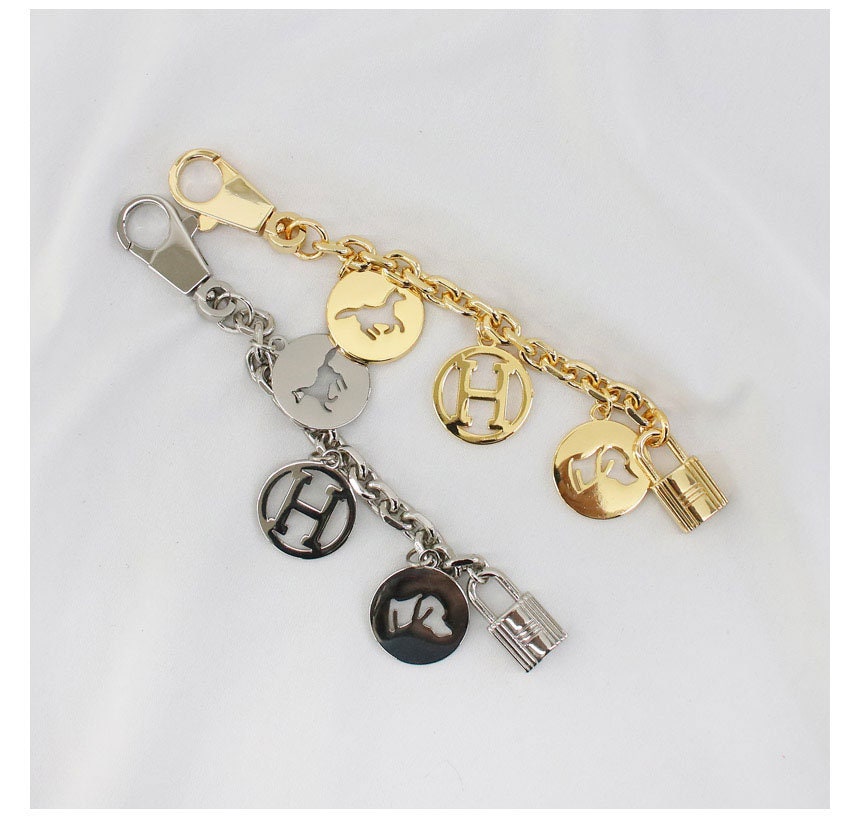 BAG CHARM H logo olga stainless