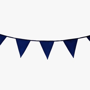 May include: A navy blue bunting with triangular flags strung together. The bunting is hanging from a white background.