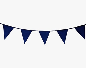 May include: A navy blue bunting with triangular flags strung together. The bunting is hanging from a white background.