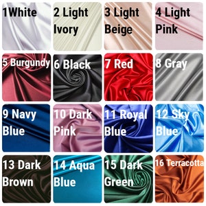 May include: A color chart of 16 different satin fabric swatches. The swatches are arranged in a 4x4 grid. Each swatch is labeled with a number and a color name. The colors include white, ivory, beige, pink, burgundy, black, red, gray, navy blue, dark pink, royal blue, sky blue, dark brown, aqua blue, dark green, and terracotta.