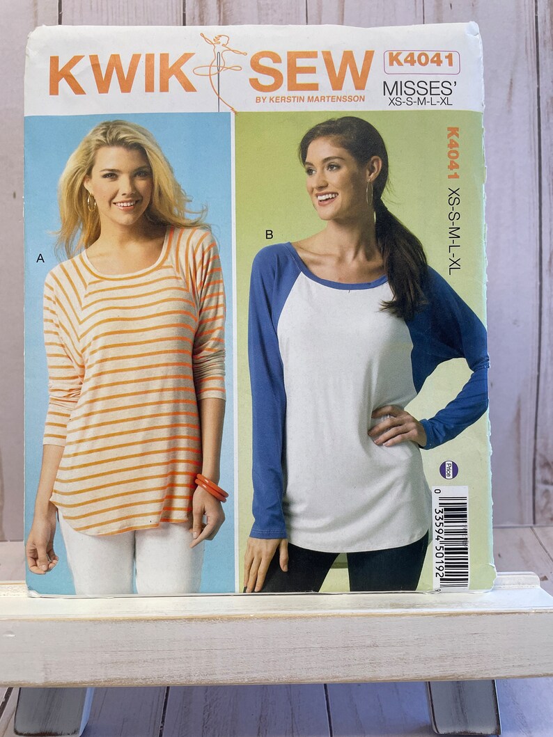 May include: Sewing pattern for two tops, one with orange and white stripes and the other with a blue and white baseball design. The pattern is for misses' sizes XS-S-M-L-XL. The pattern number is K4041.