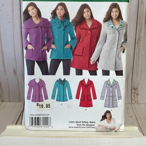 May include: Simplicity sewing pattern 1540 R5 featuring four coat designs in purple, teal, red, and gray. The pattern includes sizes 14-22 (US). The price is $16.95. The pattern is for felting.