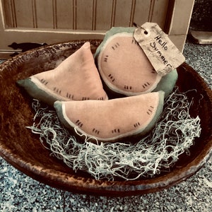 Set of three primitive watermelon slices
