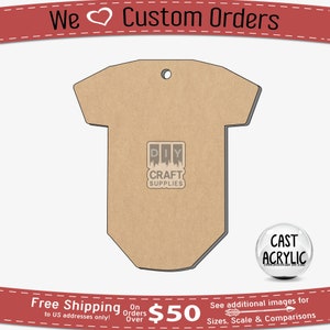 May include: A brown wooden cutout of a baby onesie with a hole at the top for hanging. The onesie is blank and ready to be painted or decorated. The onesie is 5 inches tall and 4 inches wide. The onesie is made of 1/8 inch thick wood. The onesie is perfect for crafting and DIY projects.