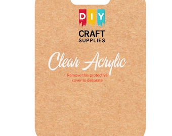 Puede incluir: Una hoja de cartón marrón con un asa recortada. La hoja tiene el texto "DIY CRAFT SUPPLIES" y "Clear Acrylic" impreso en ella. El texto "Remove this protective cover to decorate" también está impreso en la hoja.