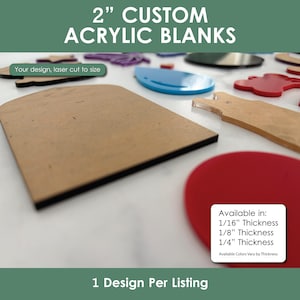 May include: A variety of custom acrylic blanks in different shapes and colors. The image includes a brown square, a blue oval, and a red heart. Text on the image reads "2" CUSTOM ACRYLIC BLANKS" and "Your design, laser cut to size."