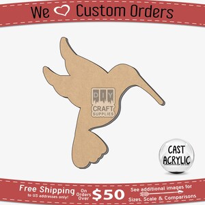 May include: A brown wooden cutout of a hummingbird in flight. The cutout is on a white background. The text "DIY CRAFT SUPPLIES" is visible in the image. The text "CAST ACRYLIC" is visible in a circle on the right side of the image.