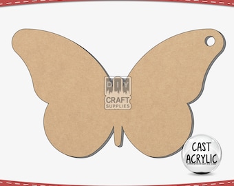 May include: A brown butterfly-shaped wooden cutout with a hole in the top right corner. The cutout is on a white background. The text "CAST ACRYLIC" is visible in a circle on the right side of the image.