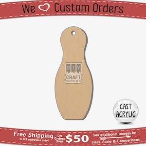 Puede incluir: Una forma de bolos de madera marrón con un agujero en la parte superior. El pin es en blanco y está listo para ser pintado o decorado. La imagen incluye el texto "DIY CRAFT SUPPLIES" y "CAST ACRYLIC".