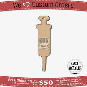 May include: A brown wooden cutout of a syringe with a hole at the top for hanging. The cutout is labeled "DIY CRAFT SUPPLIES".