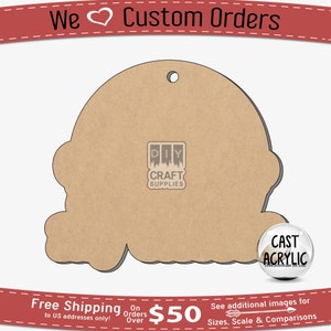 May include: A brown wooden cutout of a snowman with a hole at the top for hanging. The cutout is on a white background. The text "DIY CRAFT SUPPLIES" is visible on the cutout. The text "CAST ACRYLIC" is visible on a clear sphere.