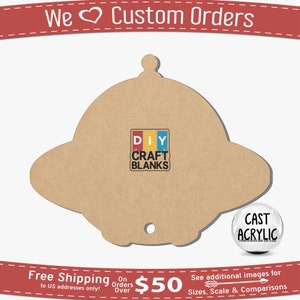May include: A brown wooden cutout of a flying saucer with a hole in the bottom. The cutout has the words "DIY CRAFT BLANKS" printed on it. The cutout is on a white background.