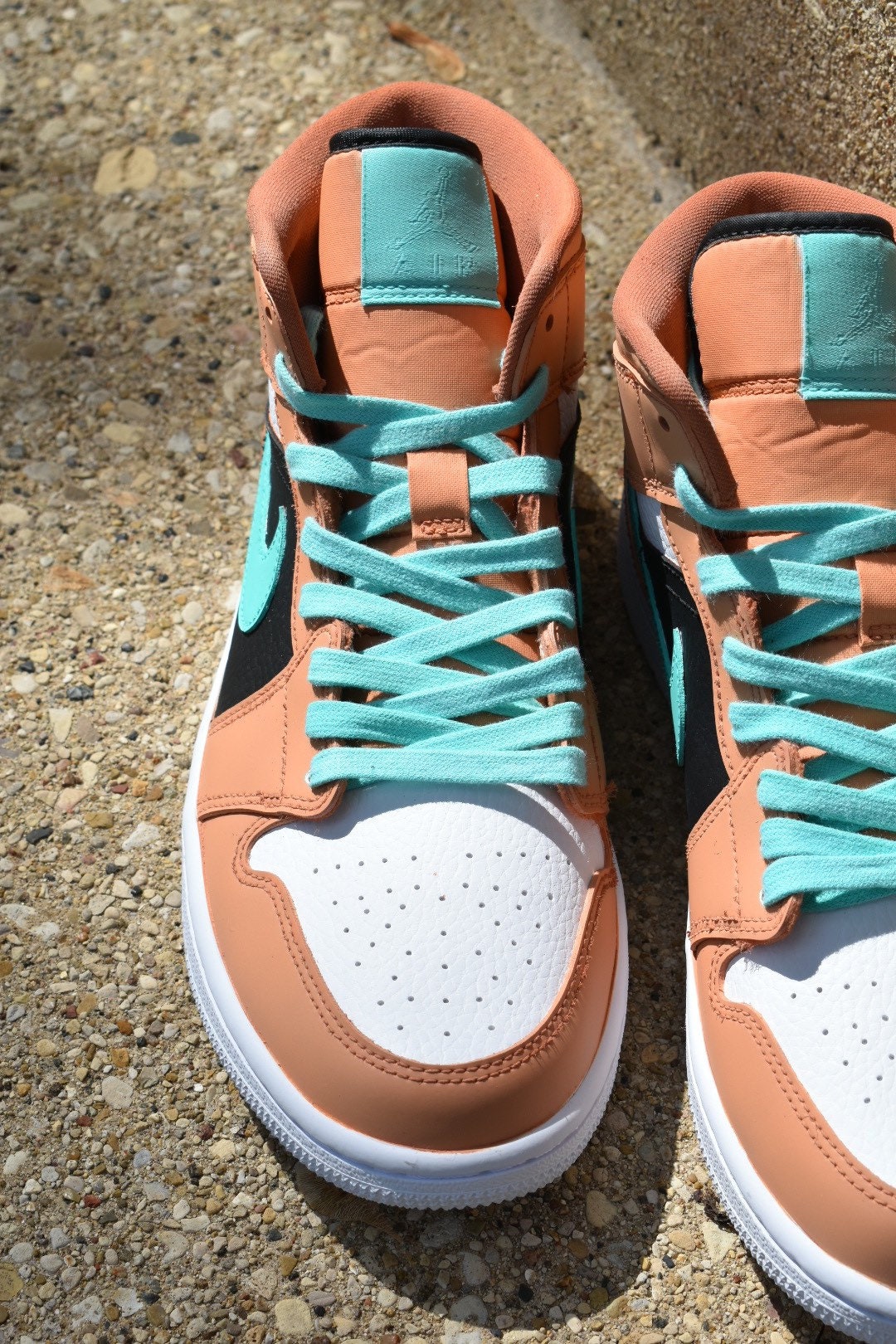 white teal and peach jordans