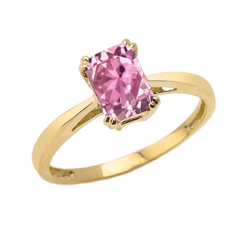 1 ct emerald cut pink cz solitaire ring in yellow gold