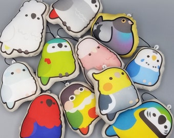 May include: A collection of 11 plush bird toys. The birds are all different colors and have different designs. Some of the birds are wearing hats or glasses. The birds are all very cute and cuddly.
