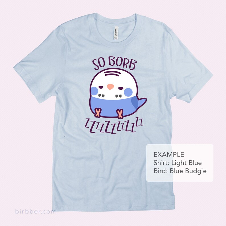 May include: Light blue t-shirt featuring a cartoon blue budgie sleeping and the text "SO BORB" and "ZZZZZZZZZZ".