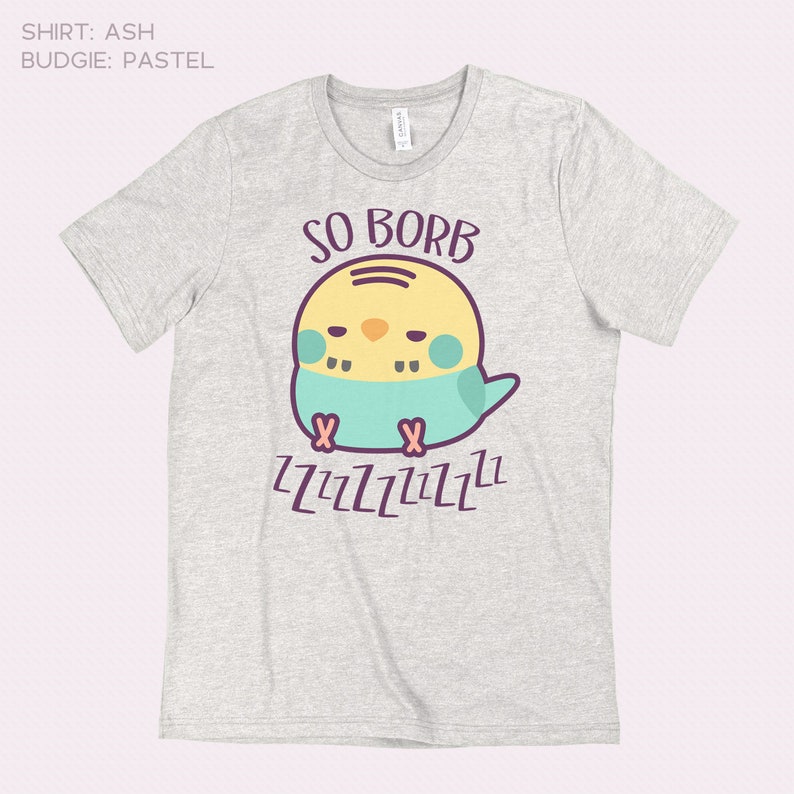 May include: A light grey t-shirt with a cartoon illustration of a yellow and blue budgie with the text "SO BORB" and "ZZZZZZZZZZ" printed on it.