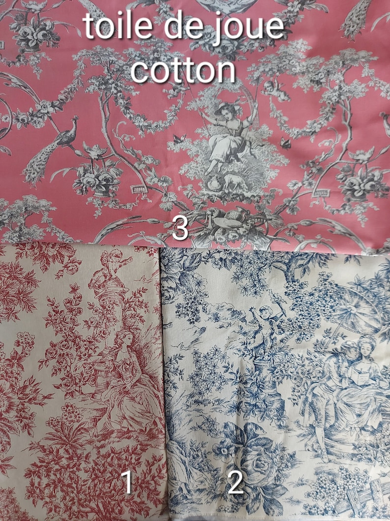 May include: Three fabric swatches with a toile de jouy pattern. The top swatch is pink with a white design. The bottom left swatch is white with a red design. The bottom right swatch is white with a blue design.