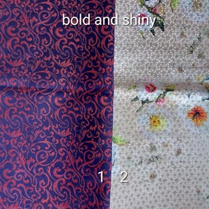 May include: Two fabric swatches side-by-side. The left swatch is a deep blue fabric with a red floral pattern. The right swatch is a light beige fabric with a white floral pattern. The text "bold and shiny" is written on the image.