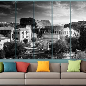 May include: Black and white photo of the Colosseum in Rome, Italy. The photo is split into five panels, showing the Colosseum from different angles. The photo is taken from a high vantage point, and the Colosseum is surrounded by trees and other buildings.