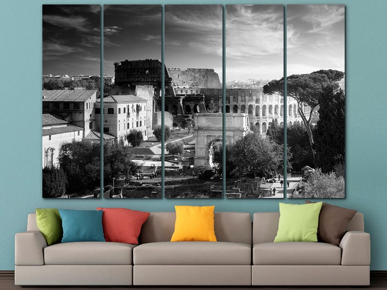 May include: Black and white photo of the Colosseum in Rome, Italy. The photo is split into five panels, showing the Colosseum from different angles. The photo is taken from a high vantage point, and the Colosseum is surrounded by trees and other buildings.