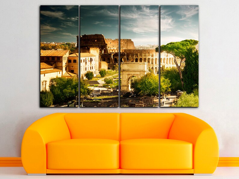 May include: A multi-panel canvas print featuring a panoramic view of the Colosseum in Rome, Italy. The image shows the ancient amphitheater, surrounding buildings, and a lush green landscape.