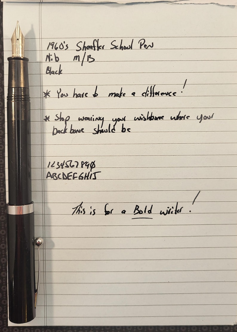May include: A black 1960's Sheaffer School Pen with a gold nib, shown on lined paper. The text on the paper includes "You have to make a difference!" and "This is for a Bold writer!"