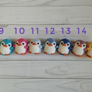 May include: Ten crocheted penguin ornaments in various colors, numbered 8 through 15.