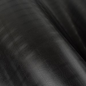 May include: Close-up of black textured fabric with a repeating pattern of small, raised dots. The fabric is draped, creating soft waves and shadows. The material has a subtle sheen, suggesting a leather or faux leather appearance.