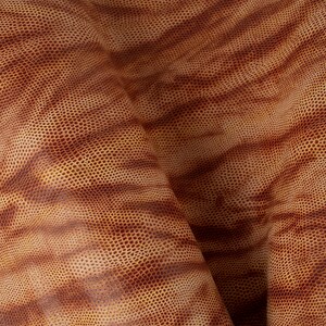 May include: Close-up of a brown leather with a textured, pebbled surface. The leather has a subtle striped pattern.