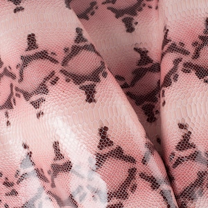 May include: Close-up of pink and brown snakeskin fabric with a textured pattern.