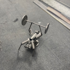 Welded sculpture of a muscle man