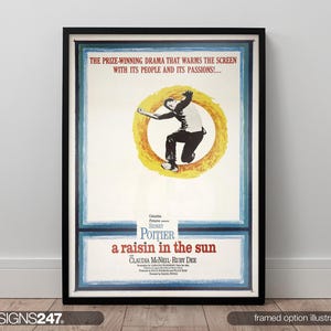 May include: Framed movie poster for "A Raisin in the Sun" in a black frame. The poster shows a man in a yellow circle, with text at the top and bottom. The poster is displayed against a white wall.